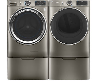 Grey GE Appliances front-load washer and dryer grouped side-by-side next to each other